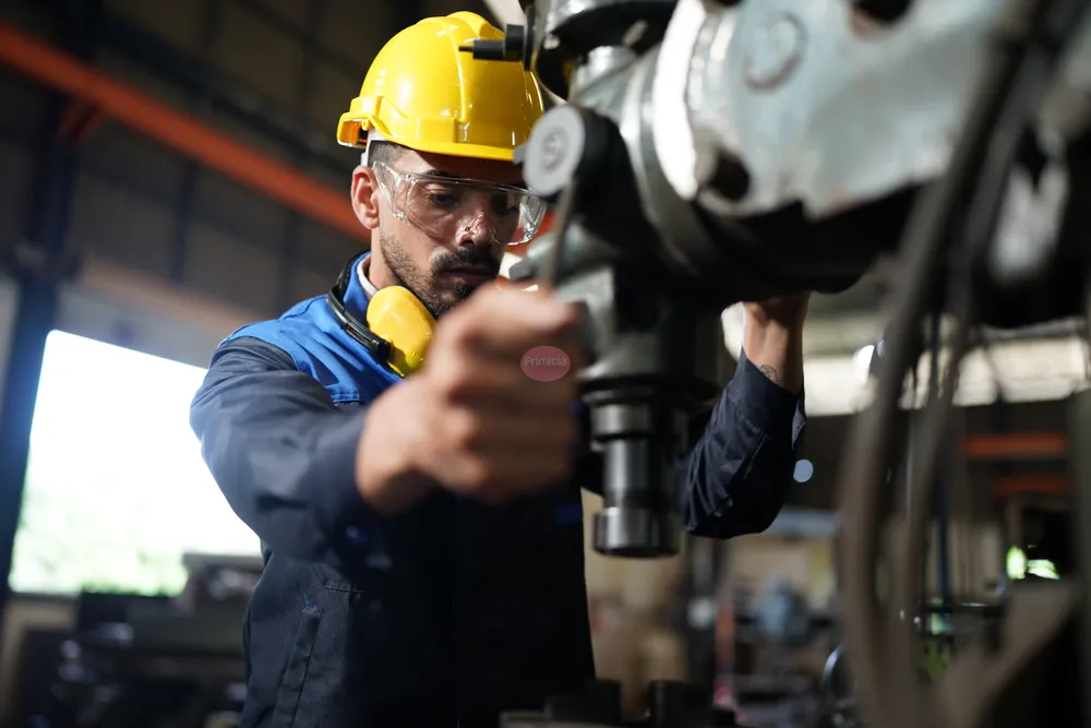 worker-at-machine-in-factory-metal-industry-worke-2023-11-27-04-53-13-utc